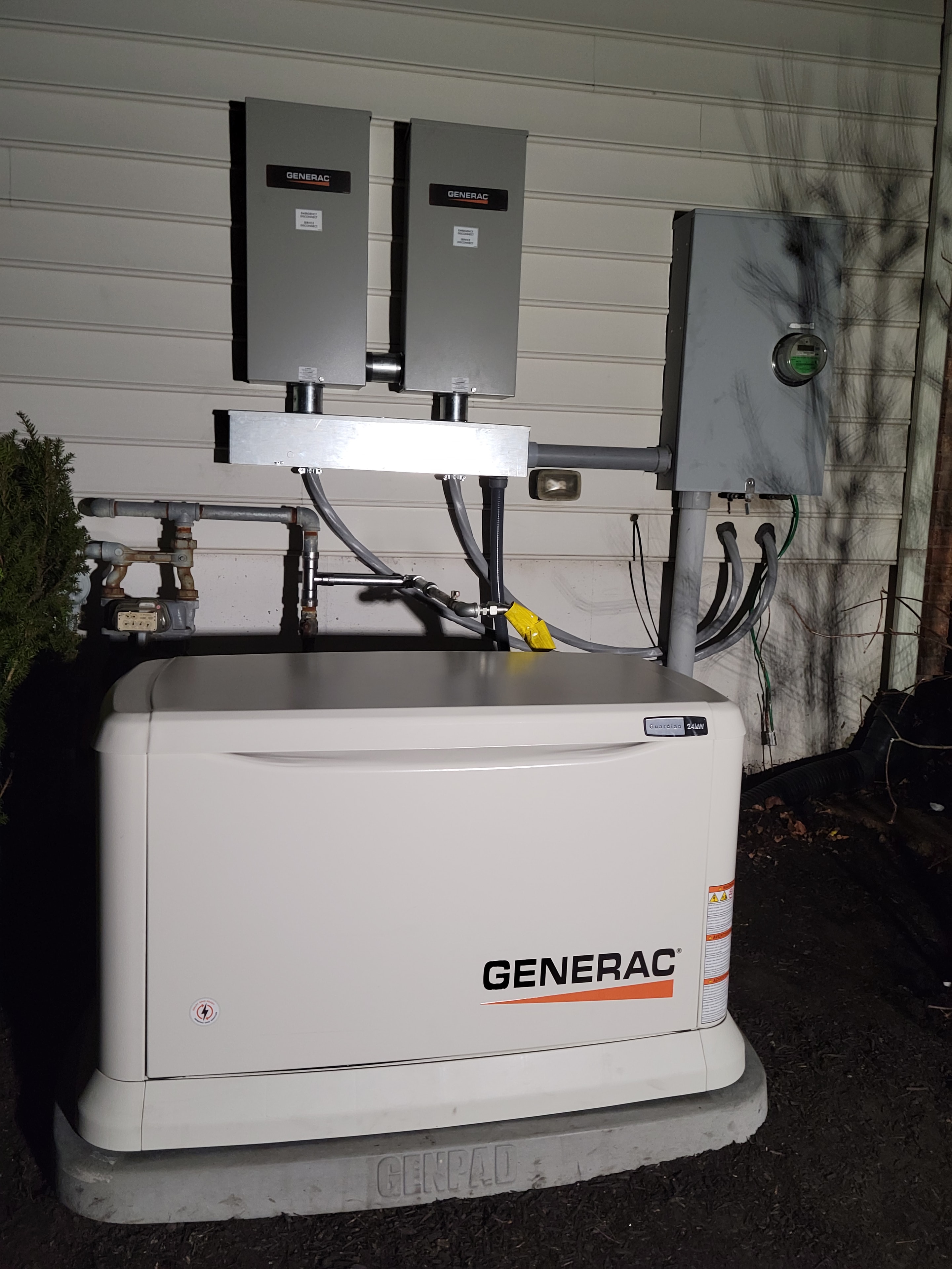 DMES LLC residential Generac standby generator installation with associated electrical equipment